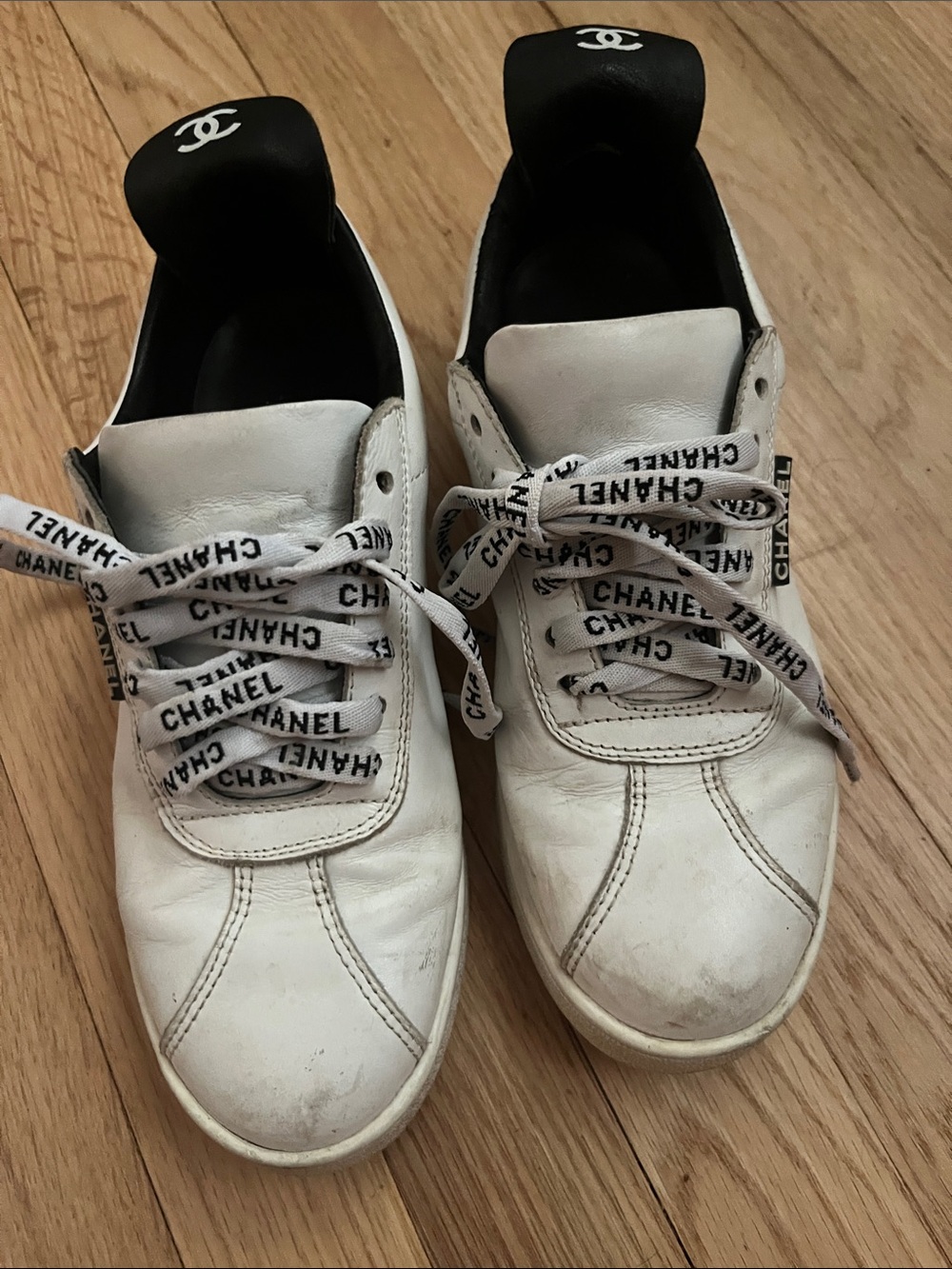 CHANEL White Leather Sneakers with Black Heel Tabs and Branded Laces